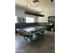 Spacious game room featuring a pool table with a light fixture, small bar area, and neutral decor at 150 S Windsor Dr # 35, Mesa, AZ 85204