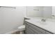 Bathroom featuring modern vanity, under sink cabinet, and commode at 1584 E Harrison E St, Chandler, AZ 85225
