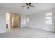 Neutral bedroom featuring modern ceiling fan, carpet, with ensuite and bath access at 1584 E Harrison E St, Chandler, AZ 85225
