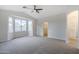 Spacious bedroom showcasing a vaulted ceiling, large windows, and neutral carpeting at 1584 E Harrison E St, Chandler, AZ 85225