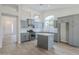 Updated kitchen with gray cabinets, an island, and stainless steel appliances at 1584 E Harrison E St, Chandler, AZ 85225