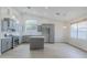 Updated kitchen with gray cabinets, stainless steel appliances, and a kitchen island at 1584 E Harrison E St, Chandler, AZ 85225