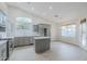 Updated kitchen with gray cabinets, stainless steel appliances, and center island at 1584 E Harrison E St, Chandler, AZ 85225