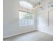 Bright living room featuring a pendant light fixture and neutral walls at 1584 E Harrison E St, Chandler, AZ 85225