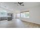 Open concept living room and kitchen with recessed lighting and wood-look floors at 1584 E Harrison E St, Chandler, AZ 85225