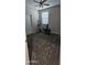 Bedroom featuring neutral walls, a ceiling fan, and fitness equipment at 17423 W Country Club Ter, Surprise, AZ 85387