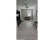 Versatile flex room with neutral paint, tile floors, and natural light, perfect for an office or hobby space at 17423 W Country Club Ter, Surprise, AZ 85387