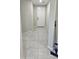 Inviting foyer with tile flooring and a white front door, perfect for a clean entry at 17423 W Country Club Ter, Surprise, AZ 85387