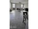 Bright and airy living room area with tile flooring, neutral walls, ceiling fan and abundant natural light at 17423 W Country Club Ter, Surprise, AZ 85387