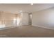 Upstairs loft area features neutral paint, carpet, recessed lighting, and access to additional rooms at 18123 W Lundberg St, Surprise, AZ 85388
