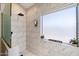 Contemporary shower with marble tile, matte black fixtures, and frosted glass at 19002 N 25Th Pl, Phoenix, AZ 85050