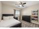 Comfortable bedroom with carpet floors, a ceiling fan, and abundant natural light at 19002 N 25Th Pl, Phoenix, AZ 85050