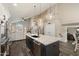 Bright open kitchen with stainless appliances, a large island, and pendant lighting at 19002 N 25Th Pl, Phoenix, AZ 85050