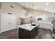 Well-lit kitchen with a center island, stainless steel appliances, and plenty of cabinet space at 19002 N 25Th Pl, Phoenix, AZ 85050