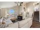 Spacious living area with vaulted ceiling, cozy fireplace, and large windows at 19002 N 25Th Pl, Phoenix, AZ 85050