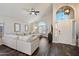 Inviting living room with vaulted ceilings, ample natural light, and stylish wood floors at 19002 N 25Th Pl, Phoenix, AZ 85050