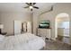 Large main bedroom with en-suite bathroom and neutral color palette at 19002 N 25Th Pl, Phoenix, AZ 85050