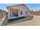Relaxing backyard offers a covered patio and low-maintenance gravel landscaping at 19860 N 110Th Ln, Peoria, AZ 85373