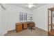 Cozy room features a ceiling fan, a shuttered window, and a wood desk at 19860 N 110Th Ln, Peoria, AZ 85373