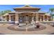 Exterior view of the community clubhouse with a decorative fountain at 19860 N 110Th Ln, Peoria, AZ 85373