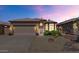 Charming single-story home with a desert landscape and a two-car garage at 19860 N 110Th Ln, Peoria, AZ 85373