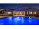 Relaxing backyard pool with fountain features, lush landscaping, and seamless indoor-outdoor living at 20151 E Via Del Palo St, Queen Creek, AZ 85142