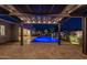 Inviting backyard pool with water features and travertine patio, perfect for outdoor entertaining under the pergola at 20151 E Via Del Palo St, Queen Creek, AZ 85142