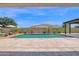 Outdoor pool with fountains, lounge chairs, and lush landscaping for relaxation at 20151 E Via Del Palo St, Queen Creek, AZ 85142