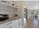 Bar area features granite countertops, custom cabinets, and access to the outdoor pool area at 20151 E Via Del Palo St, Queen Creek, AZ 85142