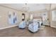 Spacious main bedroom featuring a chandelier, hardwood floors, and seating at 20151 E Via Del Palo St, Queen Creek, AZ 85142