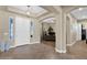 Inviting foyer showcasing a grand entrance with an archway, tiled floors, and neutral color palette at 20151 E Via Del Palo St, Queen Creek, AZ 85142