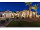 Beautiful single-story home featuring a manicured front yard, desert landscaping, and a three-car garage at 20151 E Via Del Palo St, Queen Creek, AZ 85142