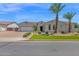 Charming single-story home featuring a neutral color palette, a well-manicured yard, and desert landscaping at 20151 E Via Del Palo St, Queen Creek, AZ 85142