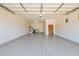 Clean, spacious garage with epoxy flooring, overhead lighting, and ample storage at 20151 E Via Del Palo St, Queen Creek, AZ 85142
