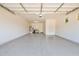 Spacious three-car garage with epoxy floors, storage cabinets, and utility connections at 20151 E Via Del Palo St, Queen Creek, AZ 85142