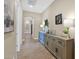 Inviting hallway with decorative console table featuring lamps and various framed photos at 20151 E Via Del Palo St, Queen Creek, AZ 85142