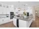 Bright kitchen with granite countertops, stainless appliances, and large central island at 20151 E Via Del Palo St, Queen Creek, AZ 85142