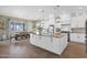 Spacious kitchen featuring a large island, modern appliances, and stylish pendant lighting at 20151 E Via Del Palo St, Queen Creek, AZ 85142