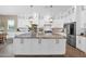 Well-appointed kitchen featuring white cabinetry, granite countertops, and stainless steel appliances at 20151 E Via Del Palo St, Queen Creek, AZ 85142
