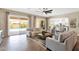 Spacious living room featuring neutral tones and access to outdoor pool area at 20151 E Via Del Palo St, Queen Creek, AZ 85142