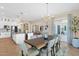 Open concept dining and kitchen space with modern lighting and decor at 20151 E Via Del Palo St, Queen Creek, AZ 85142