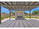 Outdoor living space featuring a pergola with an outdoor fireplace and a cornhole game set at 20151 E Via Del Palo St, Queen Creek, AZ 85142