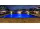 Luxury swimming pool featuring water fountain features, lush landscaping and travertine pool deck at 20151 E Via Del Palo St, Queen Creek, AZ 85142