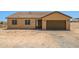 Tan single-Gathering home showcasing a brown garage door and matching door with two windows and a simple landscape at 21859 W Gail Dr, Buckeye, AZ 85326