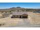 Aerial view of house showing mountain views and desert landscaping at 21859 W Gail Dr, Buckeye, AZ 85326