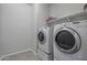 Bright laundry area features white appliances and plenty of room to move around at 21859 W Gail Dr, Buckeye, AZ 85326