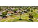 Gorgeous aerial view of home on golf course with pool and luscious mature landscaping at 2448 S Standage --, Mesa, AZ 85202