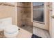 Neutral colored bathroom with glass enclosed shower and modern toilet at 2448 S Standage --, Mesa, AZ 85202