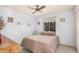 Cozy bedroom with comfortable bed, ceiling fan, and good window light at 2448 S Standage --, Mesa, AZ 85202