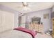 Bedroom with ceiling fan, dresser, and a closet at 2448 S Standage --, Mesa, AZ 85202